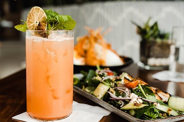 Cocktail and shared plates on the table